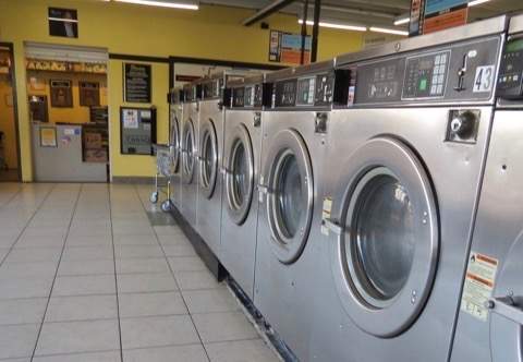 Okeechobee Parrot Avenue location. Close up of a row of front-loading washers.