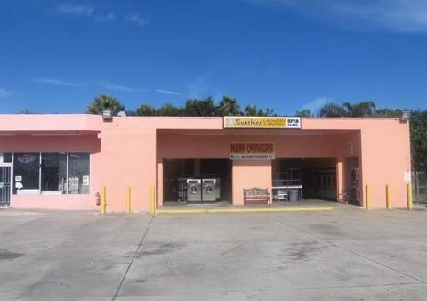 Okeechobee location. Clean exterior. Pink Building.